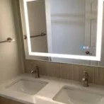Double vanity with backlit mirror